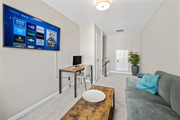 Home office desk with laptop and notepad for owner reporting